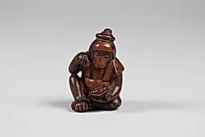 Netsuke of Monkey Examining Turtle by Unknown Artist