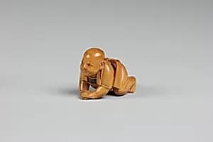 Netsuke of Crawling Child by Unknown Artist