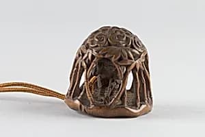 Netsuke of man in a bamboo grove by Unknown Artist