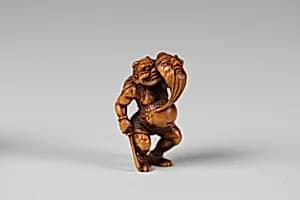 Netsuke of Demon with a Mask by Unknown Artist