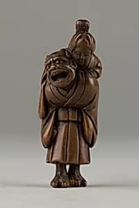 Netsuke of Demon Carrying a Woman on His Shoulders by Unknown Artist