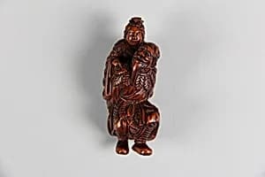 Netsuke of Old Man Carrying a Woman on His Back by Unknown Artist