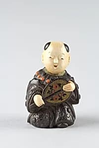 Netsuke of Boy with a Fan by Unknown Artist