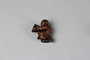 Netsuke of Boy Riding a Hobby Horse by Unknown Artist