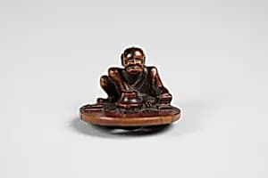 Netsuke of a Wheel Maker by Unknown Artist
