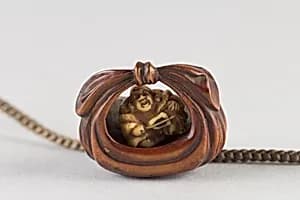 Netsuke of Bag Containing a Figure of Hotei by Unknown Artist