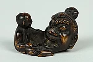 Netsuke of Sculptor Modelling a Large Head by Unknown Artist