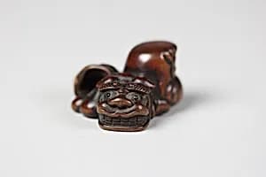 Netsuke of Three Masks by Unknown Artist