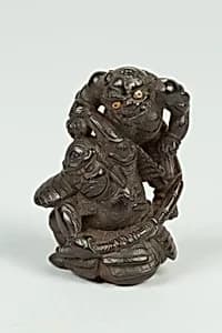 Netsuke of Demon Attacking a Man by Unknown Artist