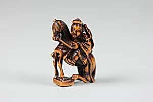 Netsuke of Equestrian Figure on a Go Board by Unknown Artist