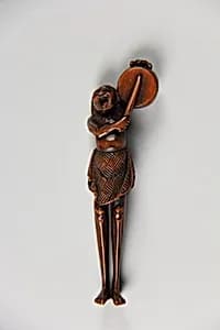 Netsuke of Ashinaga Beating a Drum by Unknown Artist
