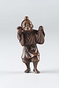 Netsuke of Boy Wearing a Mask by Unknown Artist