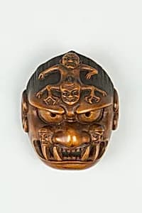Netsuke of Grotesque Mask by Unknown Artist