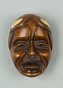 Netsuke of Woman's Face by Unknown Artist