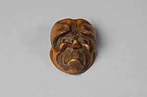 Netsuke: Mask of Unhappy Old Man by Unknown Artist
