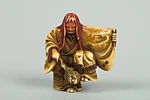 Netsuke of Noh Dancer with Long Red Hair and Peony by Unknown Artist