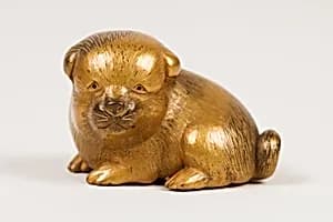 Netsuke of Seated Puppy with Short Curled Tail by Norizane