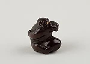 Netsuke of Monkey with One Hand over Mouth, the Other Behind His Back by Miwa