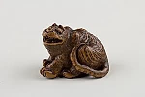 Netsuke of Seated Tiger with Tail Curled beside Him by Minkō