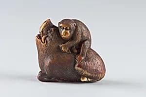 Netsuke of Monkey Attacking a Boar by Unknown Artist