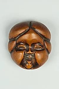 Netsuke of Noh Mask; Face of Usume by Unknown Artist