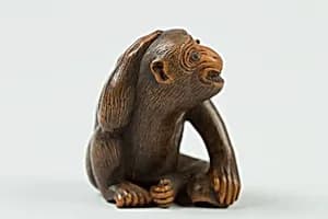 Netsuke of Monkey with a Bee on His Back by Unknown Artist