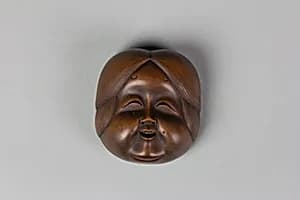 Netsuke of Kyōgen Mask: Usume (or Ofuku or Okame) by Unknown Artist