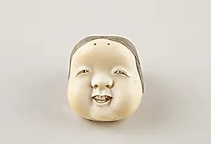 Netsuke of Kyōgen Mask; Usume (or Okama or Ofuku) by Unknown Artist