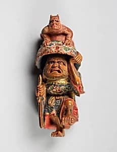 Netsuke of Man with an Ōni on His Hat by Unknown Artist