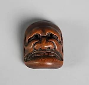 Netsuke of Kyōgen Mask: Buaku by Unknown Artist