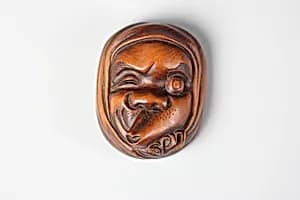Netsuke of Noh Mask: One-Eyed Hyottoko by Unknown Artist