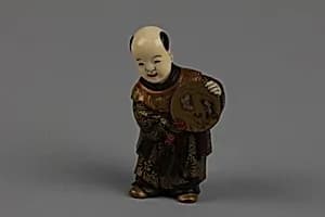 Netsuke of Boy with a Fan by Unknown Artist