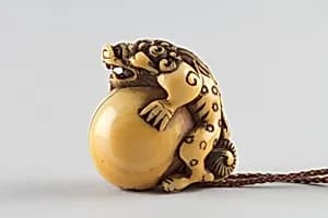 Netsuke in the Shape of a Lion with a Ball by Unknown Artist
