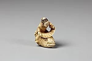Netsuke of the Sage, Kinkō Carrying a Scroll and Seated on a Carp by Unknown Artist