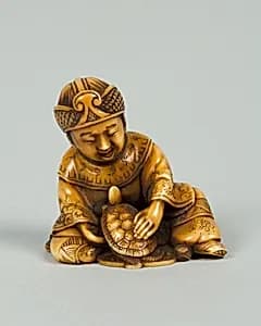 Netsuke of Boy with Tortoise by Unknown Artist