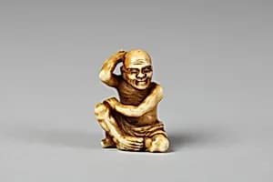 Netsuke of Figure of a Man Scratching His Back by Unknown Artist