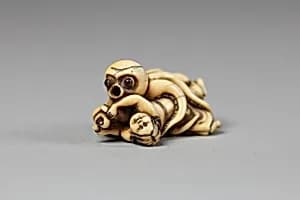 Netsuke of Octopus Attacking a Woman by Unknown Artist