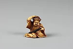 Netsuke of Girl at her Toilet by Unknown Artist