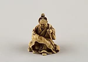 Netsuke of Woman Reading from a Scroll by Unknown Artist
