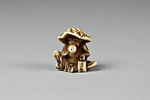 Netsuke of Monkey with Lotus Leaf Hat by Unknown Artist