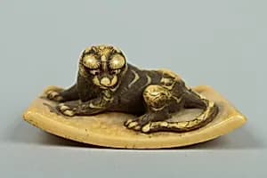 Netsuke of Tiger Lying on a Mat by Unknown Artist