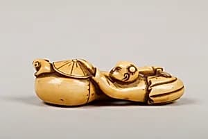 Netsuke of Boy Catching a Mouse in a Gourd by Unknown Artist