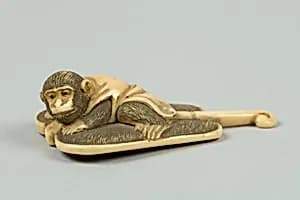 Netsuke of Monkey on a Bamboo Fan by Unknown Artist