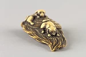 Netsuke of Puppies on a Bamboo Whisk by Unknown Artist