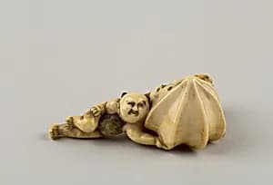 Netsuke of Boy Carrying a Branch of Fruit by Unknown Artist