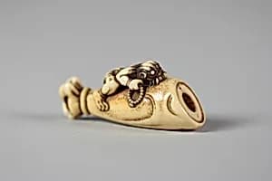 Netsuke of Hand and Forearm of a Demon with Small Demon on the Side by Unknown Artist