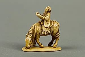 Netsuke of Man Riding a Horse by Unknown Artist