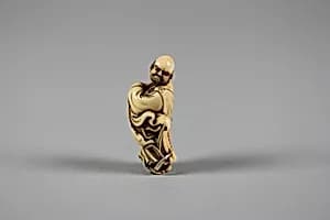 Netsuke of Daruma Crossing the Yangzi River on a Reed by Unknown Artist