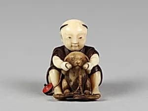 Netsuke of Boy Playing with a Dog by Unknown Artist