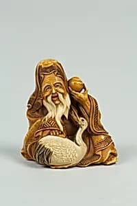 Netsuke of Old Man and Stork by Unknown Artist